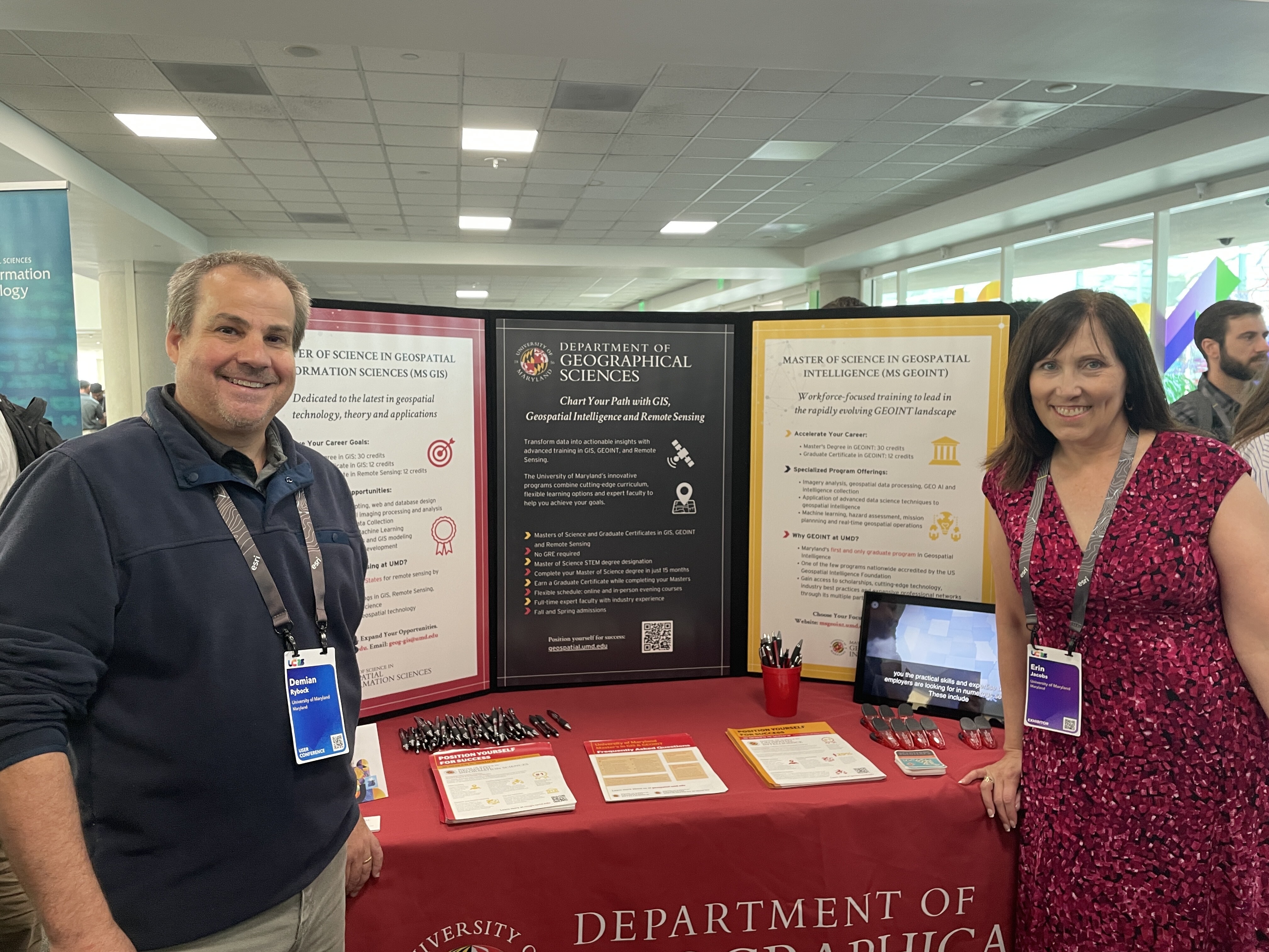 Image 1: Demian Rybock and program coordinator Erin Jacobs at the MS GIS and GEOINT table during the Academic Fair at the Esri User Conference.