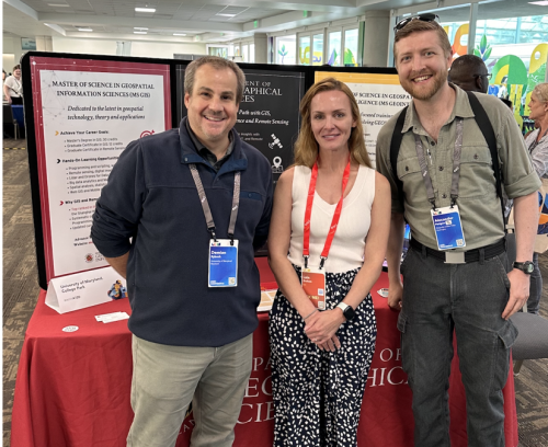 Demian Rybock (Left), Lain Graham (Center), and Alexander Perigon (Right) at the MS GIS and GEOINT table during the Academic Fair at the Esri User Conference